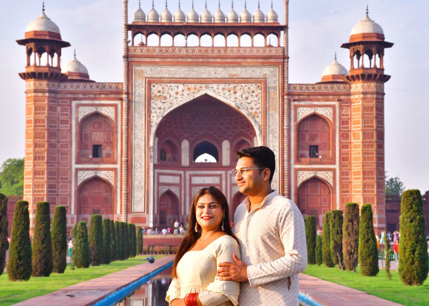 A couple photographed in front of the Taj Mahal's Great Gate