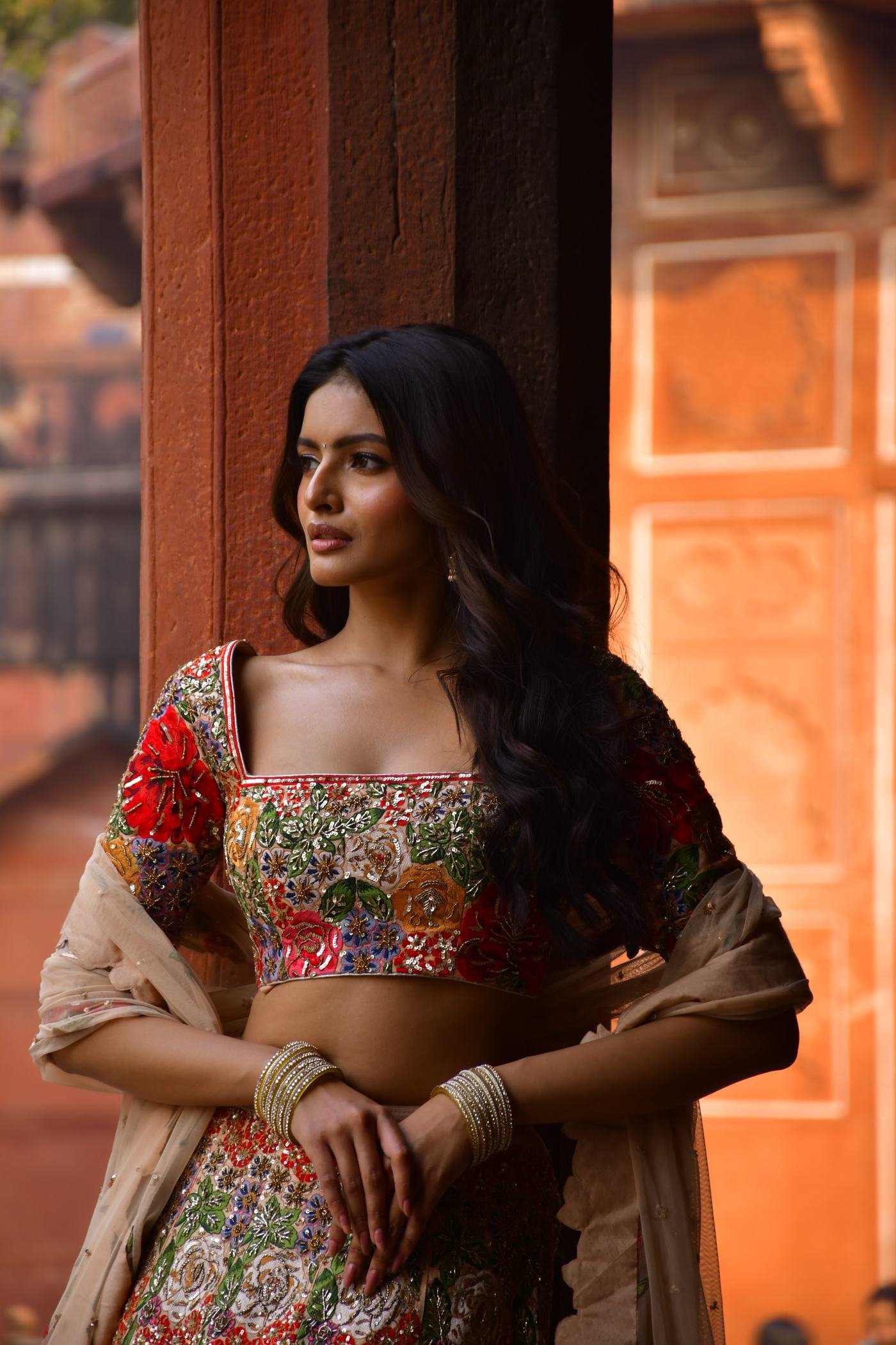 Close-up detail of embroidered lehenga and jewellery at Agra Fort